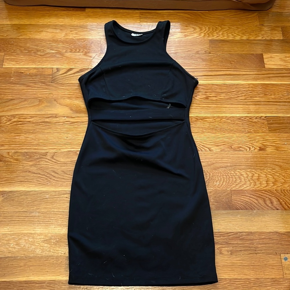 Black body con mini dress large cut out over stomack with strap. Very flattering